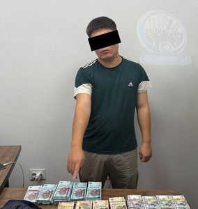 Қўқонда қалбаки пул савдоси билан шуғулланган 23 ёшли бола қўлга олинди