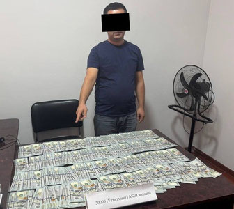 Фарғонада солиқ идораси ходими 30 минг доллар пора билан ушланди